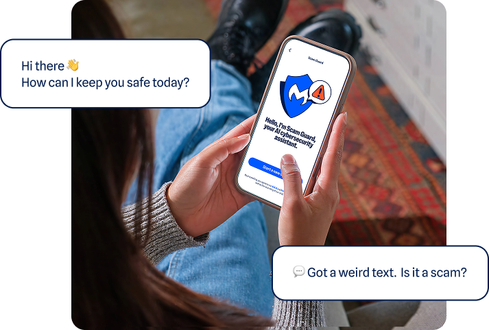 Person holding a phone showing a suspicious-message check on screen